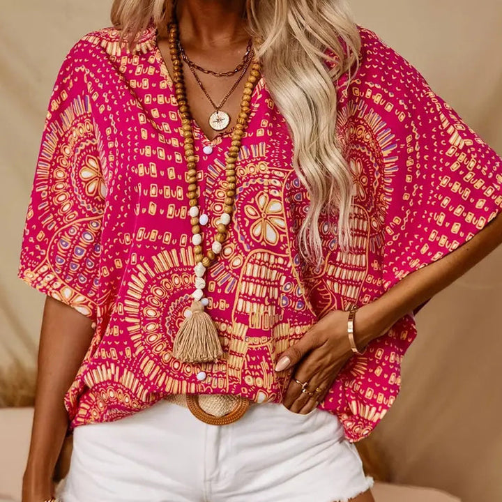 Noellise - Blusa artística com mangas morcego