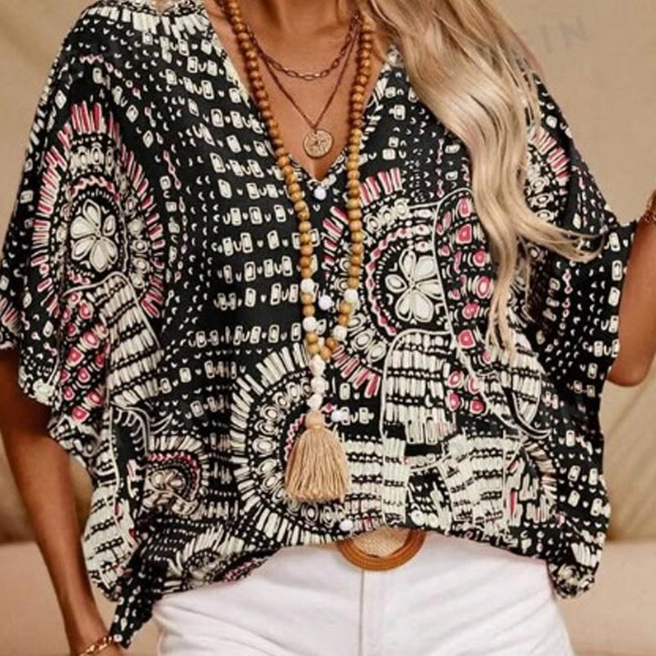 Noellise - Blusa artística com mangas morcego