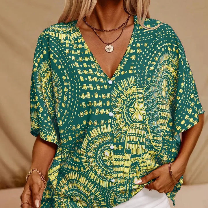 Noellise - Blusa artística com mangas morcego
