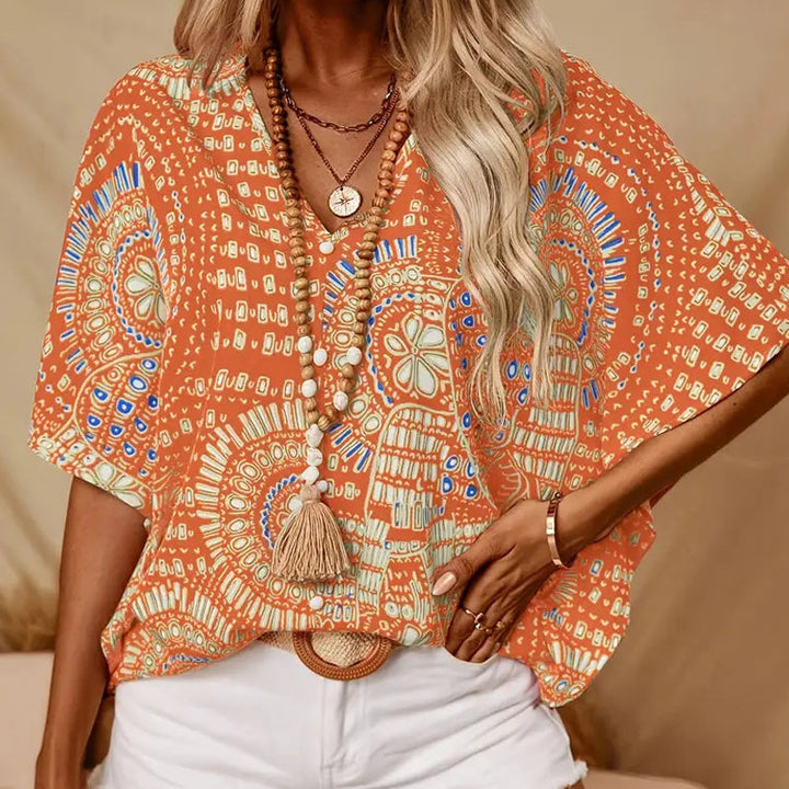 Noellise - Blusa artística com mangas morcego