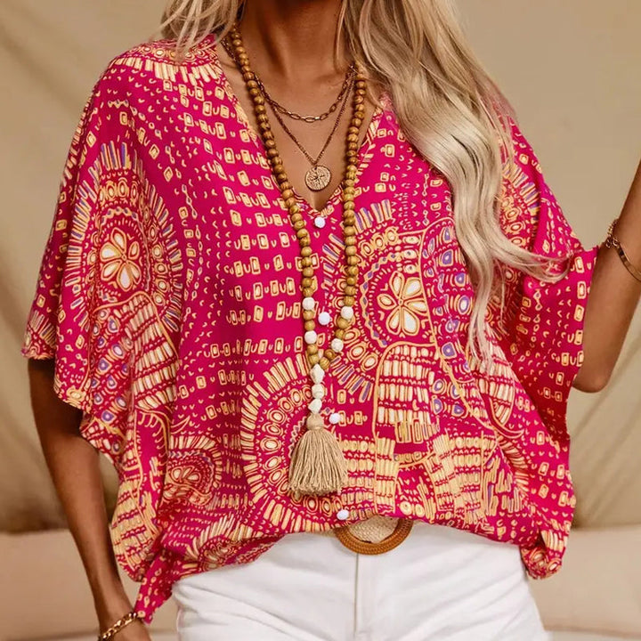 Noellise - Blusa artística com mangas morcego